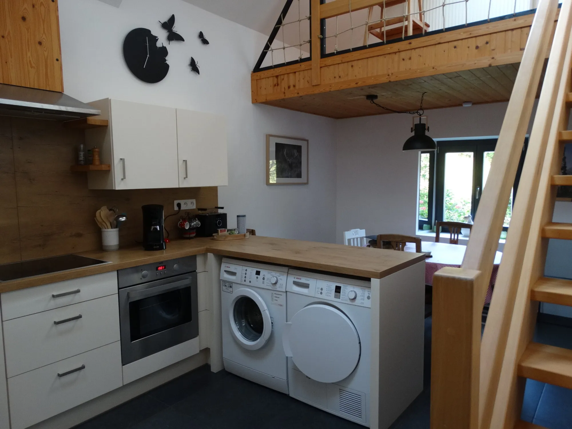 The kitchen and the stairs to the mezzanine
